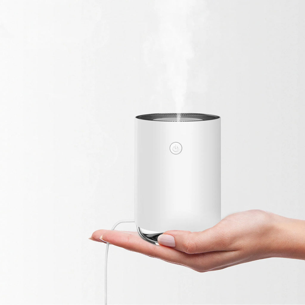 Night light humidifier diffuser in white showing mist output and ambient lighting