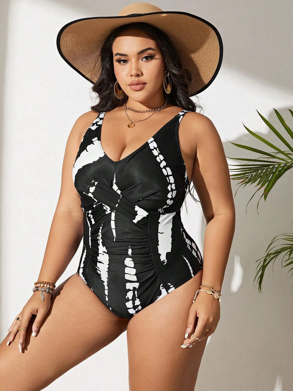 Black Siamese colour matching fit one-piece swimsuit on a hanger.