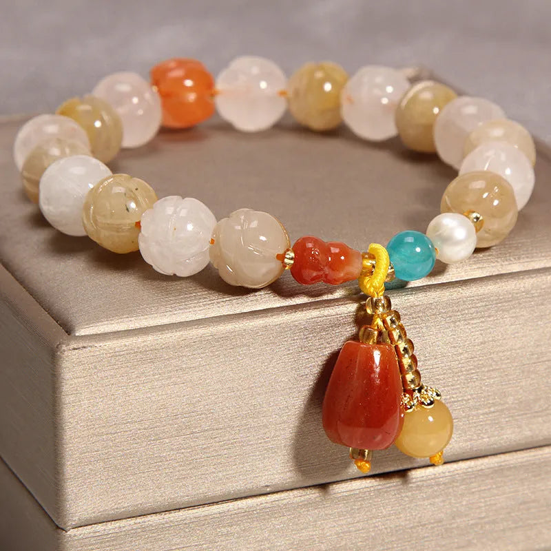 Women's adjustable crystal bracelet with yellow agate stones and gold silk thread.