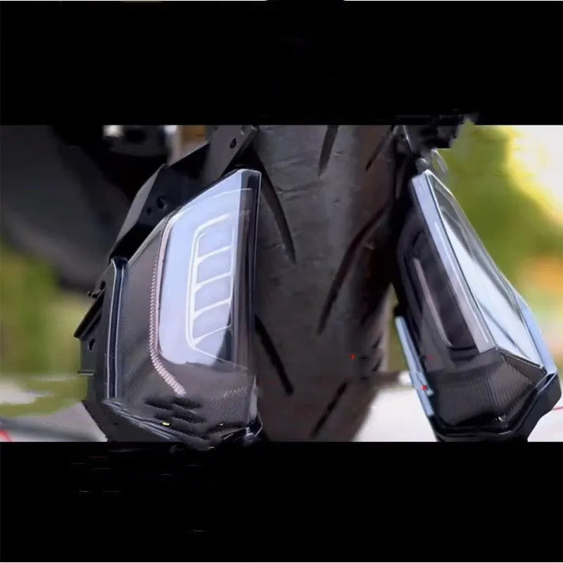 Pair of LED turn signal lights for Yamaha NMAX155 scooter in plastic housing.