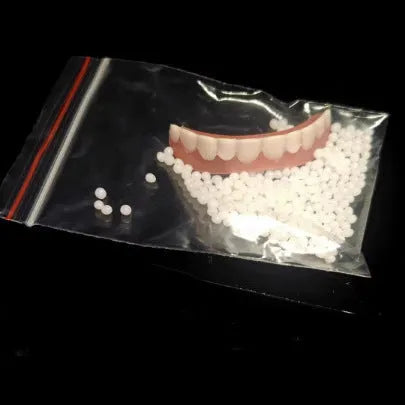 Silicone simulation dental dentures showing upper and lower teeth in training configuration