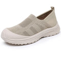 Women's beige, black and purple slip-on shoe covers with cloth upper and flat PVC sole.