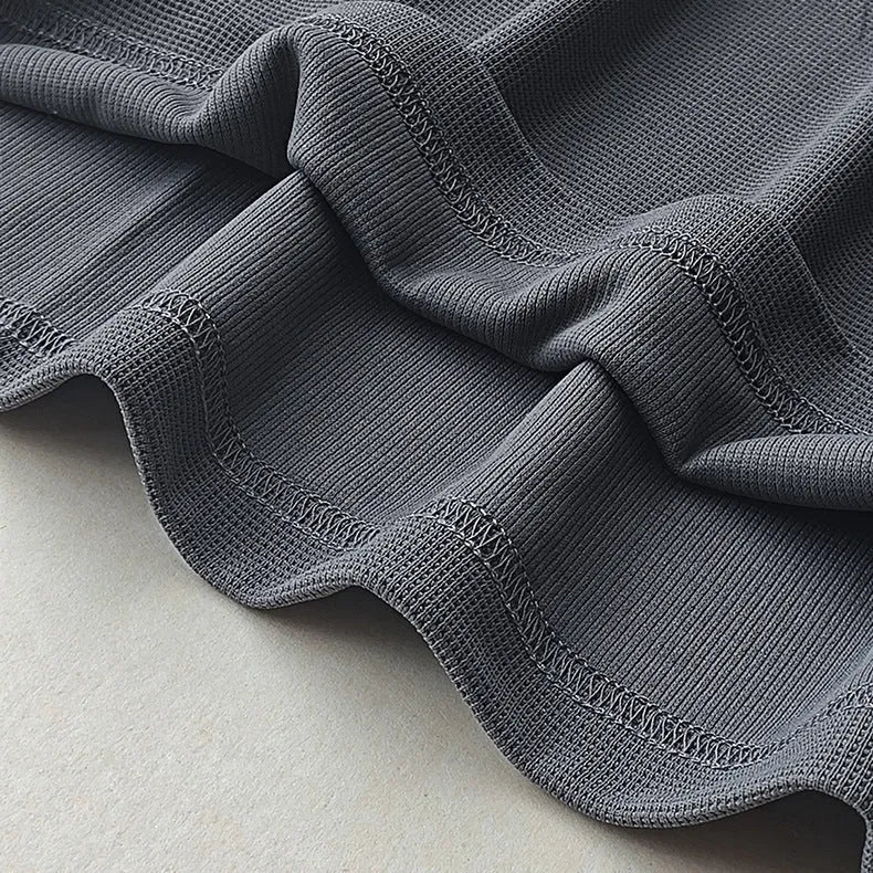 Men's heavyweight waffle-knit short-sleeve t-shirt in a solid colour, shown on a hanger.