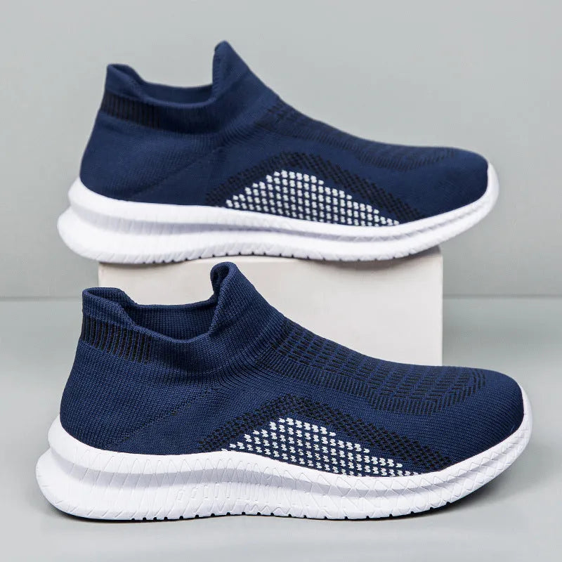 Men's white Popcorn Flyknit low-top casual sneaker on a solid background.