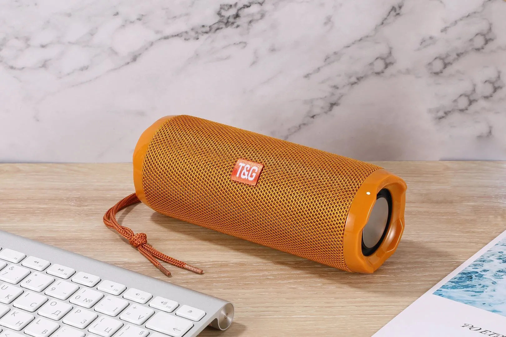 Fabric portable Bluetooth speaker in a choice of colours showing the integrated card holder slot.