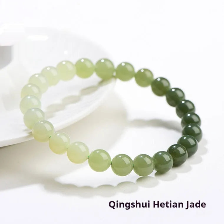 Natural gradient water Hetian jade bead bracelet showing round and barrel bead options on an adjustable string.