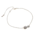 Women's gold tone alloy bracelet with a detailed pineapple charm on an adjustable chain.