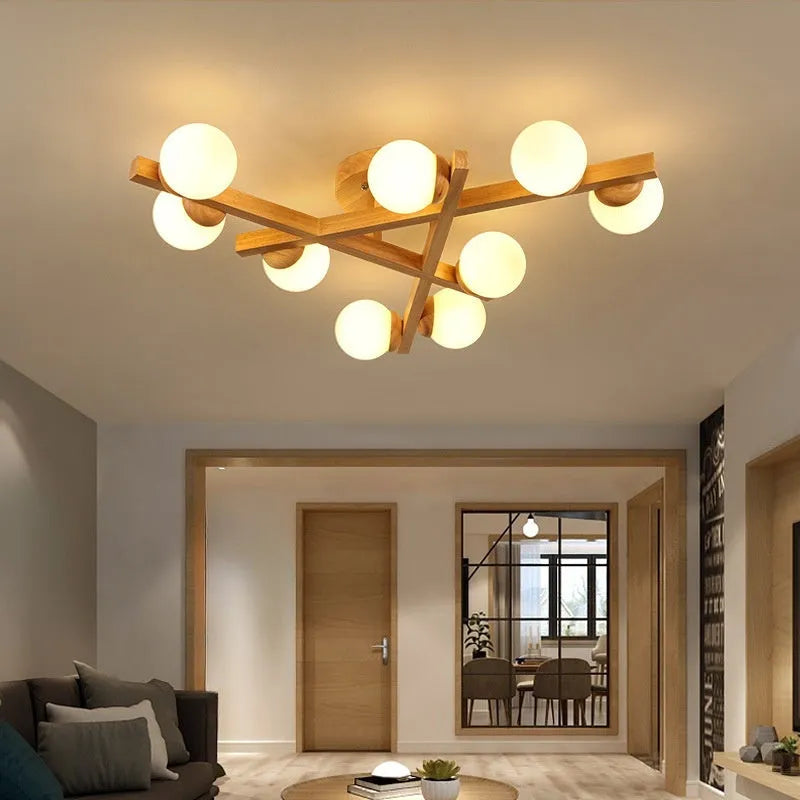 Wooden style modern Nordic ceiling light with three neutral light heads.