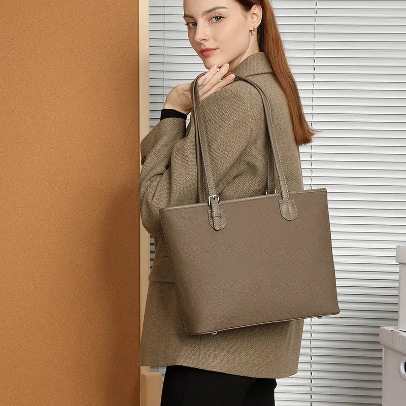 Genuine leather women's retro tote bag in dark grey showing internal zipper and phone pockets
