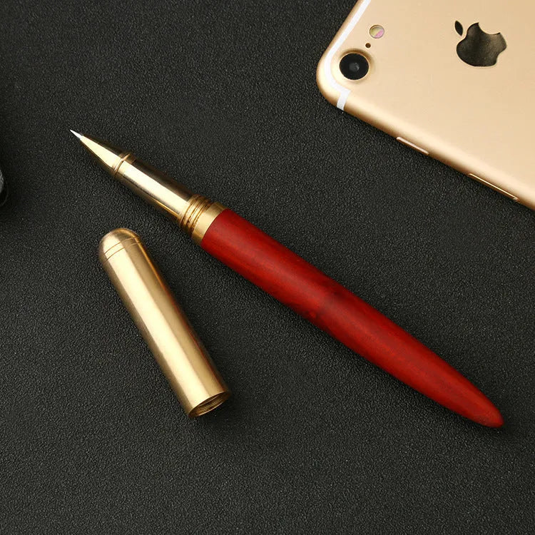 Brass and sandalwood signature pen with wooden barrel, shown alongside a ruler indicating 14 cm length.
