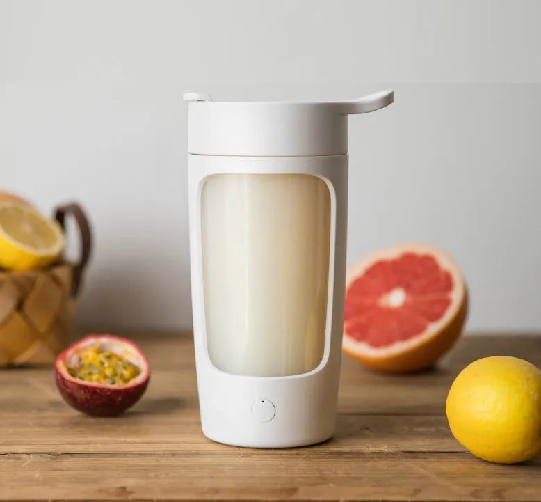 Automatic mixing cup portable juice blender in black, blue, pink, and white colours showing 650ml capacity