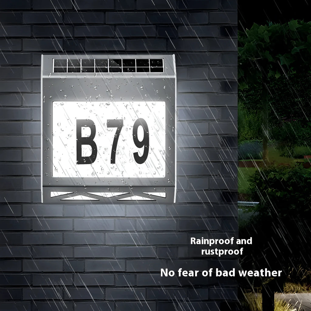 Solar powered waterproof doorplate light in black or silver with LED illumination for house numbers