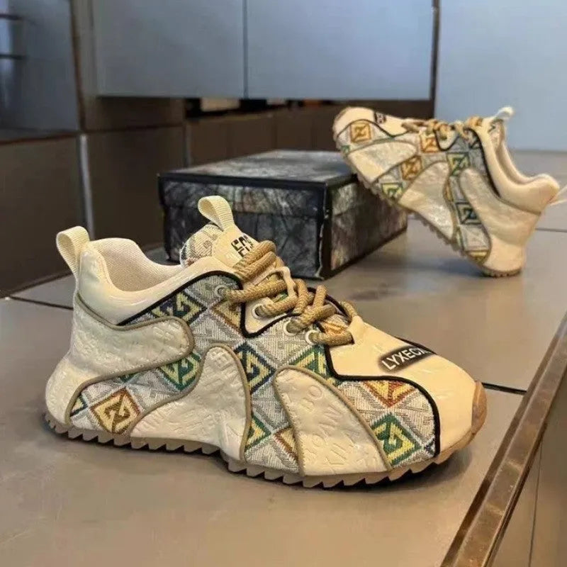Men's beige platform casual shoes with embroidery detail on the PU upper and a rubber sole.