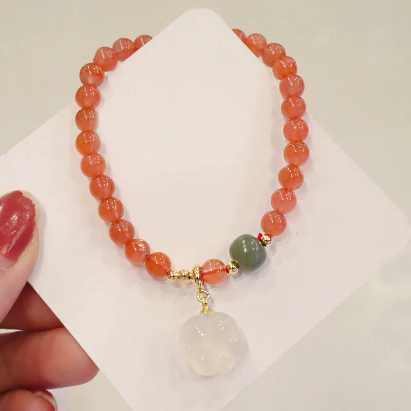 Natural red agate bracelet with cat paw design in gem inlay, 6mm width