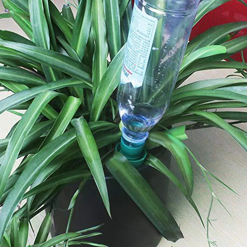 Green ceramic automatic plant watering dripper device for attaching to cola bottles