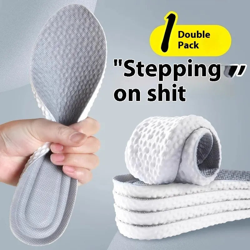 Pair of grey PU foam sports insoles on a white background, showing trimmable edges.