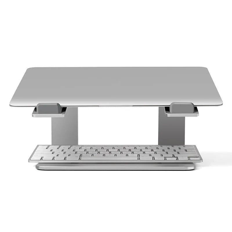 Black aluminium laptop stand with angled platform on a wooden desk