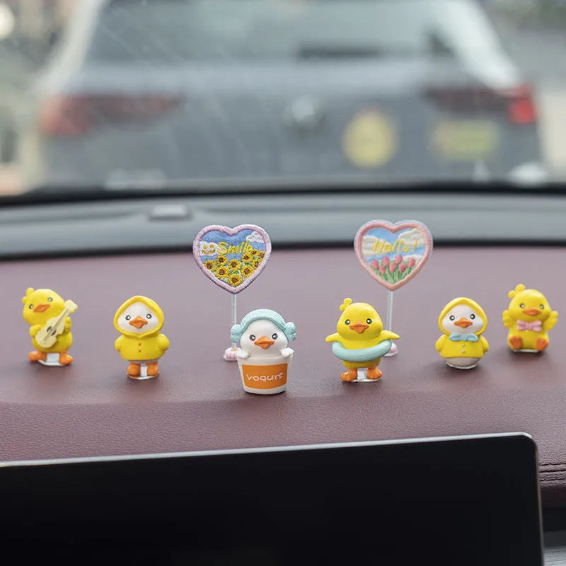 PVC duckling car interior decoration set showing six cartoon ducks and custom sign for vehicle dashboard