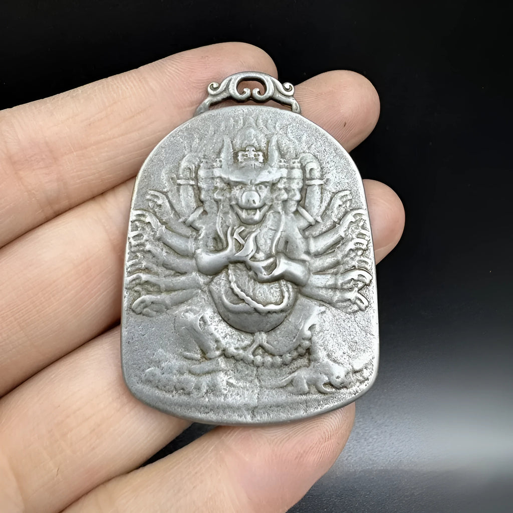 Close-up of iron hanging ornament pendant depicting Aryaacalanatha, Yamantaka in Chinese style.