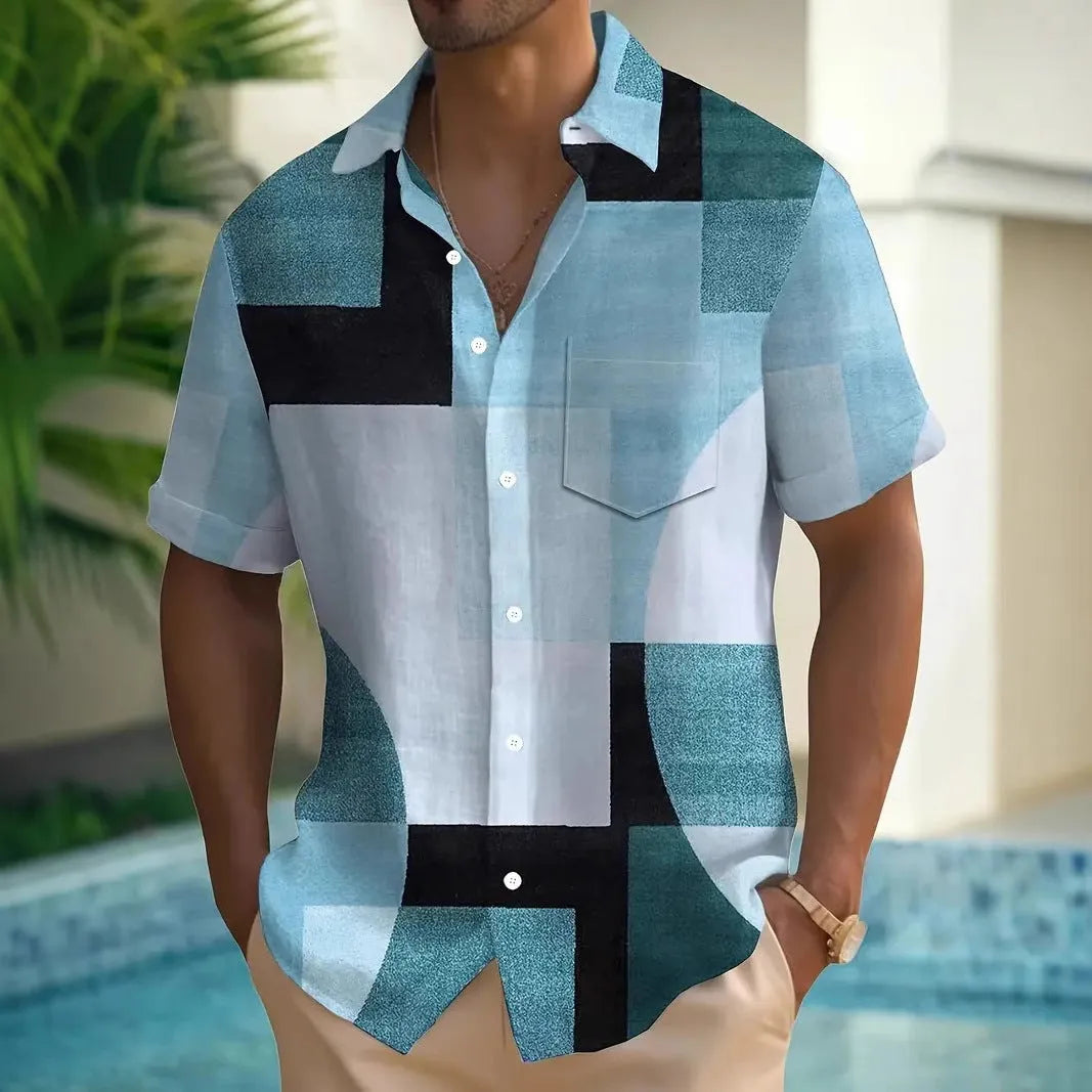 Man wearing a short sleeve cardigan with a blue and white retro geometric square print pattern.