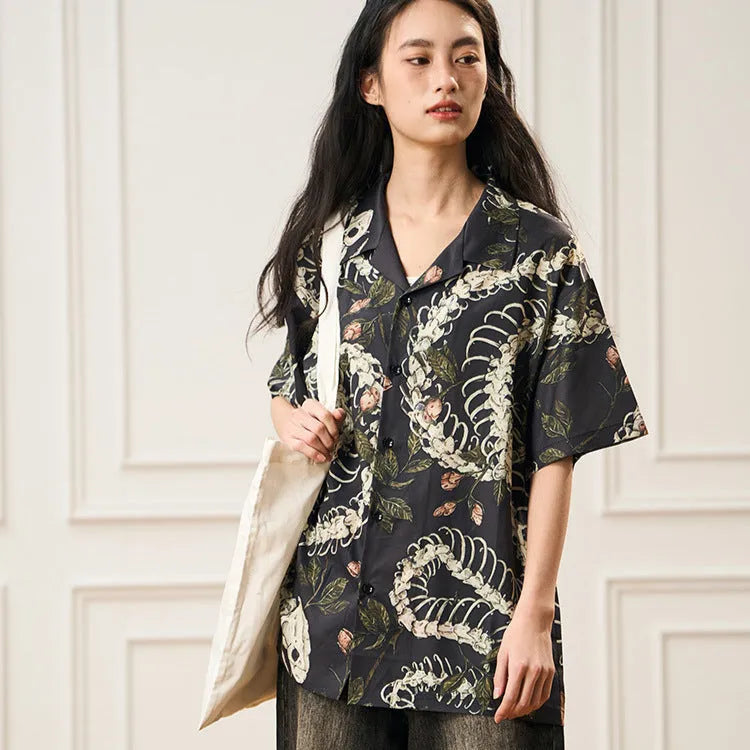 Short sleeve loose fit Cuban collar shirt with snake bone and floral printed pattern.