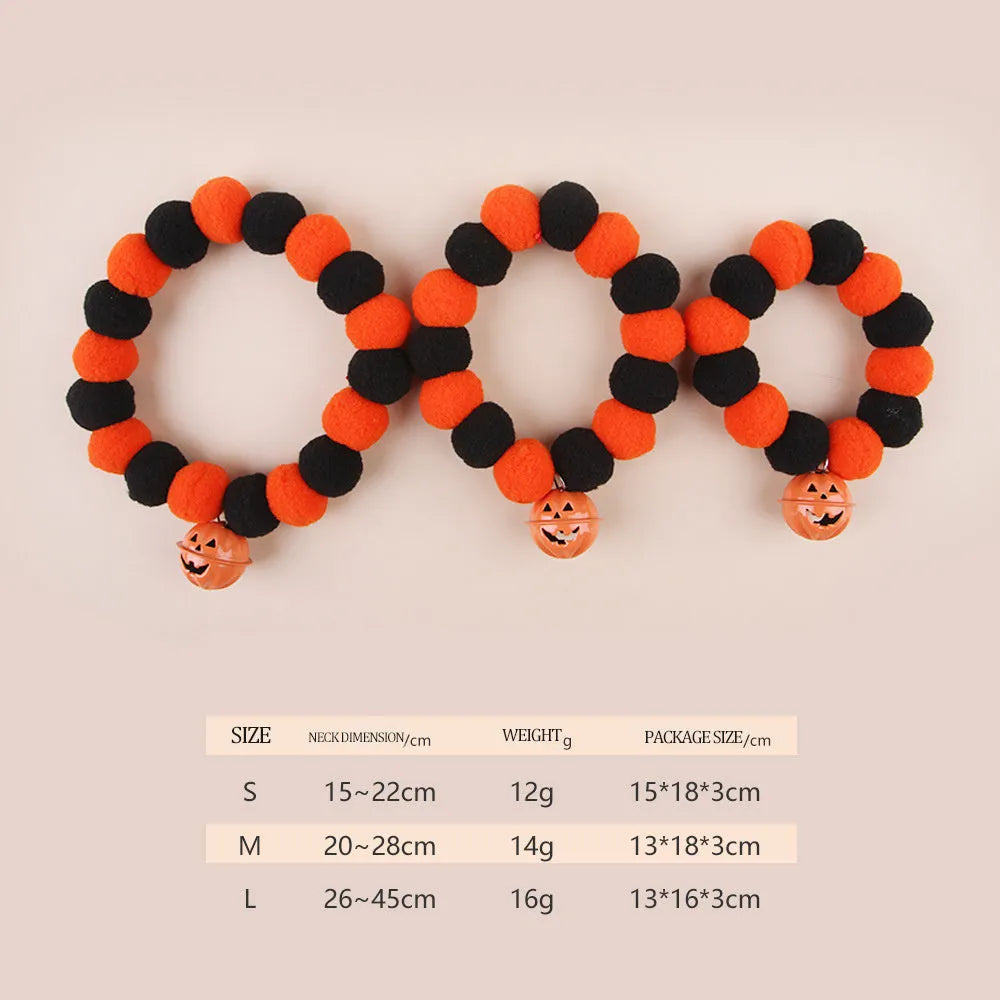 Adjustable orange plastic cat collar with a detailed Halloween pumpkin decoration.