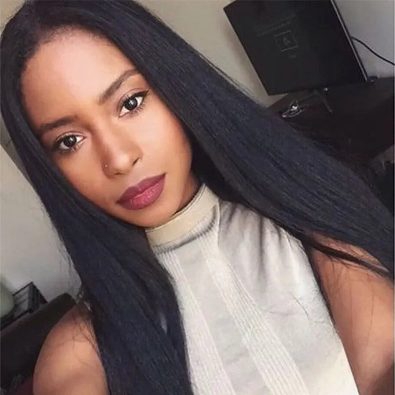 Long straight black synthetic wig with centre-parted bangs on a wig stand