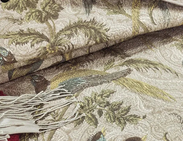 Blue American-style floral and bird quilted cotton bedspread set on a bed, showing its 230x250 cm size.