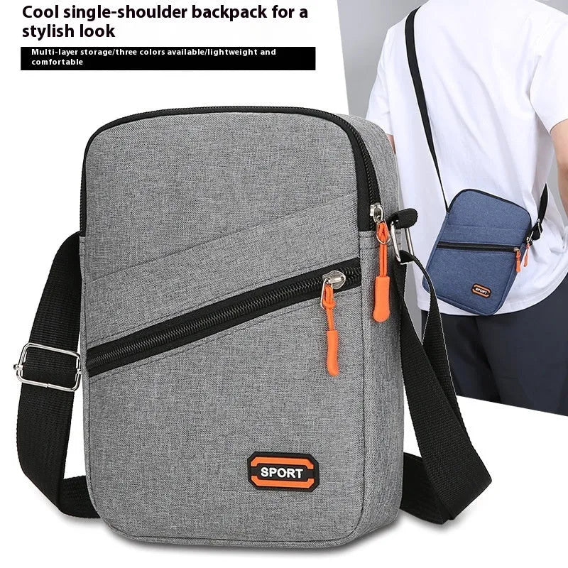Oxford cloth ultra-light crossbody commuter bag in solid colour with contrasting details.