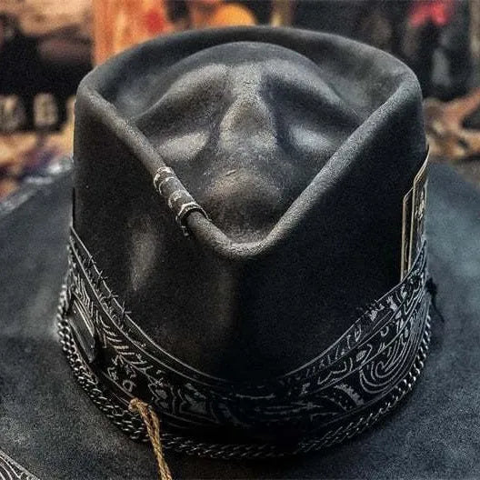 Handmade conical skull hat crafted from wool felt and denim fabric in a dark colour.