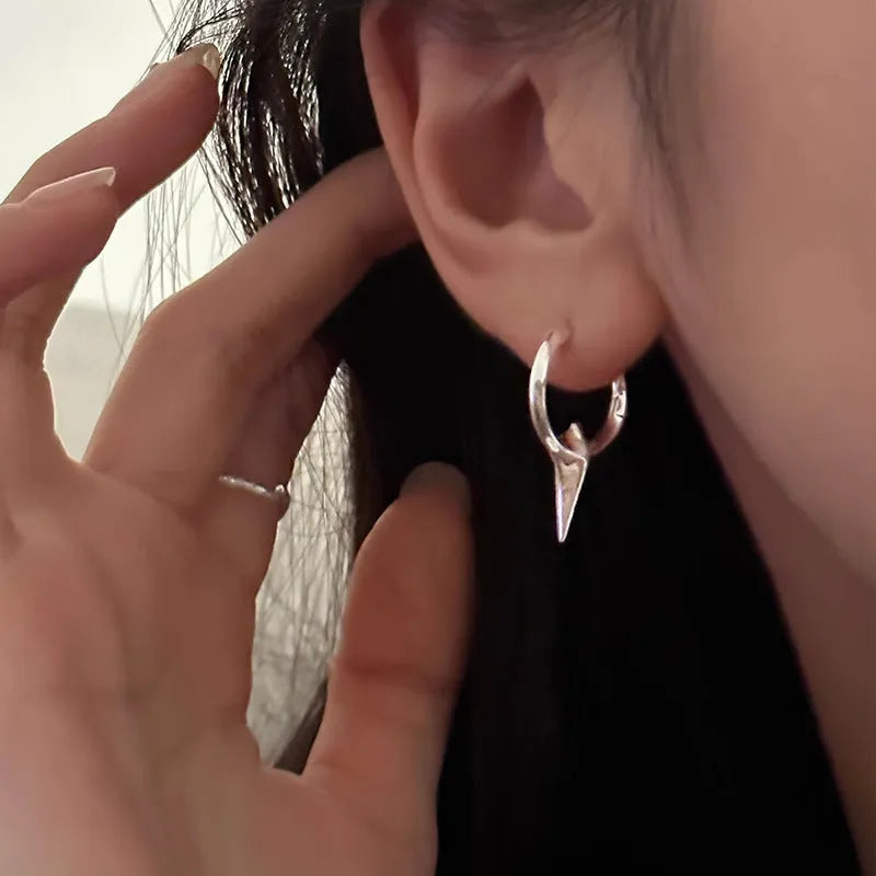 Geometric star-shaped ear clip earrings in platinum colour with copper construction