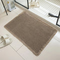 A square, checkered-pattern bathroom carpet in a choice of colours on a tiled floor.