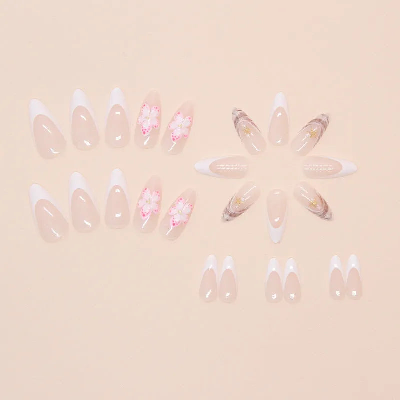 French style false nails with rock pattern and simple W1764 flower design in a plastic kit.