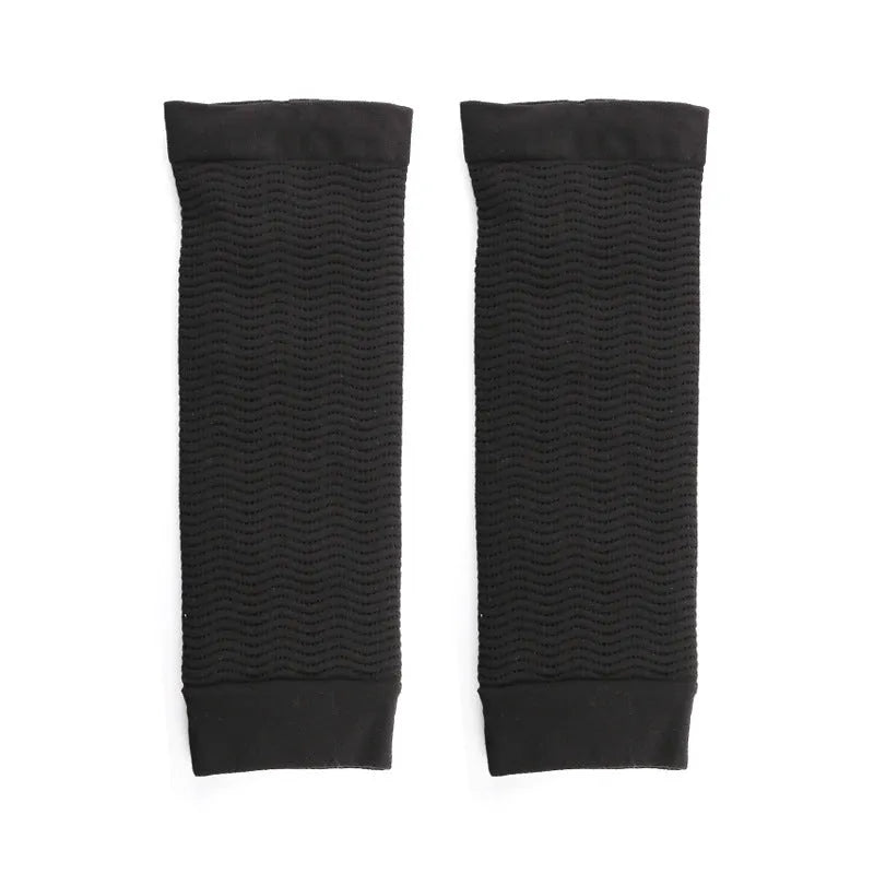 Black and skin colour women's shaping arm sleeves made from nylon blend fabric.