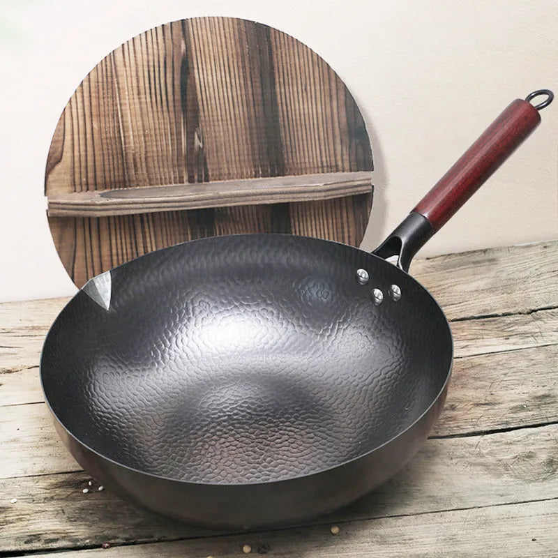 Traditional black iron wok measuring 40cm with wooden handle and glass lid option