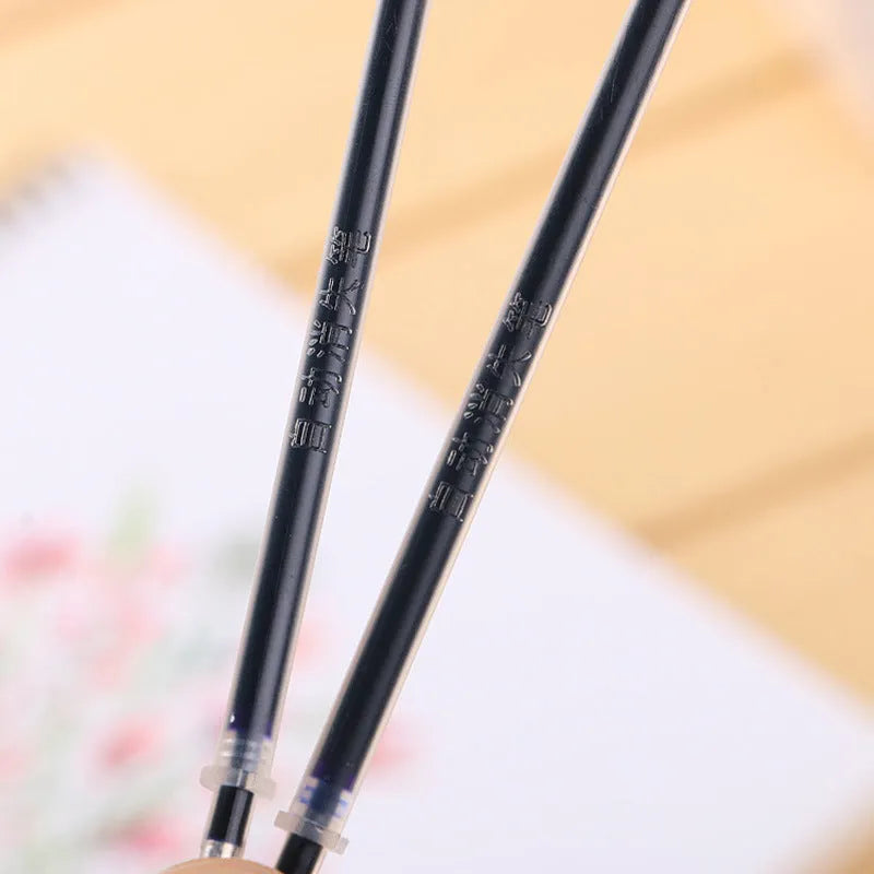 Automatic fade and disappear pen set showing pen holder and eight refill cartridges