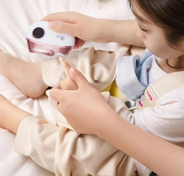 Blue electric nail clipper and polisher with USB Type-C charging port and cleaning brush.