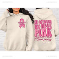 Breast Cancer Awareness pullover hoodie with retro print and side seam pockets in pink.