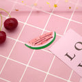 Children's metal hair barrette with colourful printed strawberry design and baking varnish finish