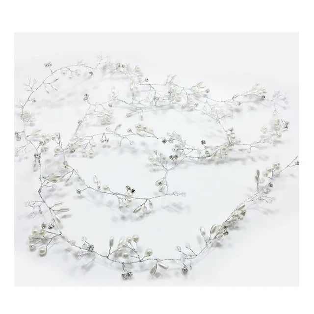 Handmade silver crystal and pearl long hair band for bridal hairstyles on a mannequin head.