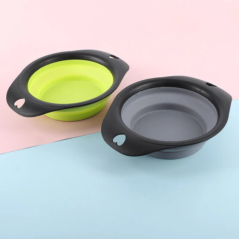 Black silicone pet bowl shown both folded flat and snapped open, next to a dog leash.