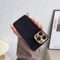 Leather texture iPhone case in grey lying flat, showing its slim profile and solid colour design.