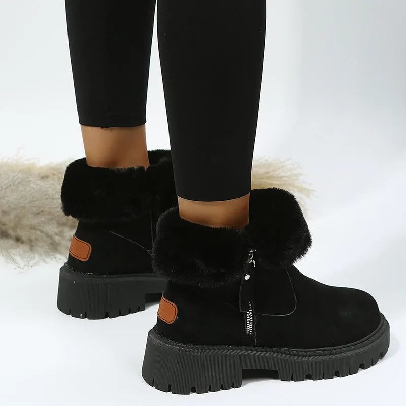 Women's black thick plush snow boot with side zipper and round toe on a rubber sole.