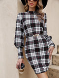 Black tight dress with lantern sleeves and leather stitching details, mid-length silhouette.