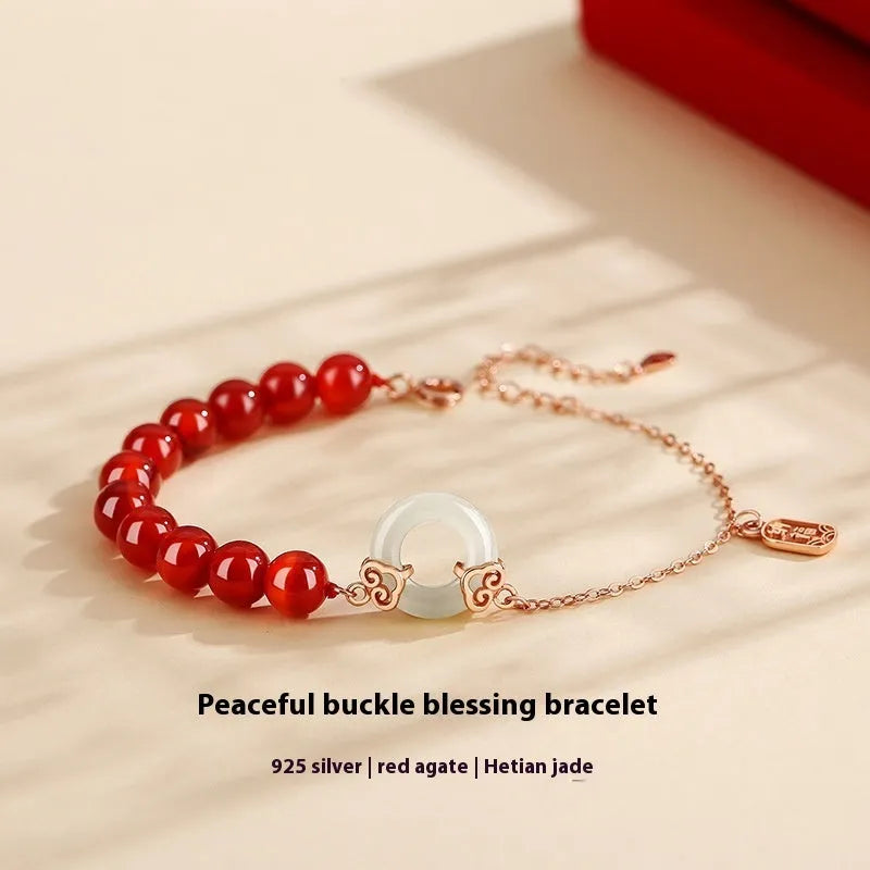 Sterling silver 925 bracelet with a peace buckle charm, xiangyun designs, and a fu character.