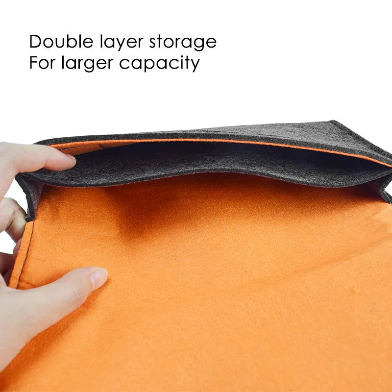 Black felt pouch case for Nintendo Switch open to show console compartment and five game card slots.