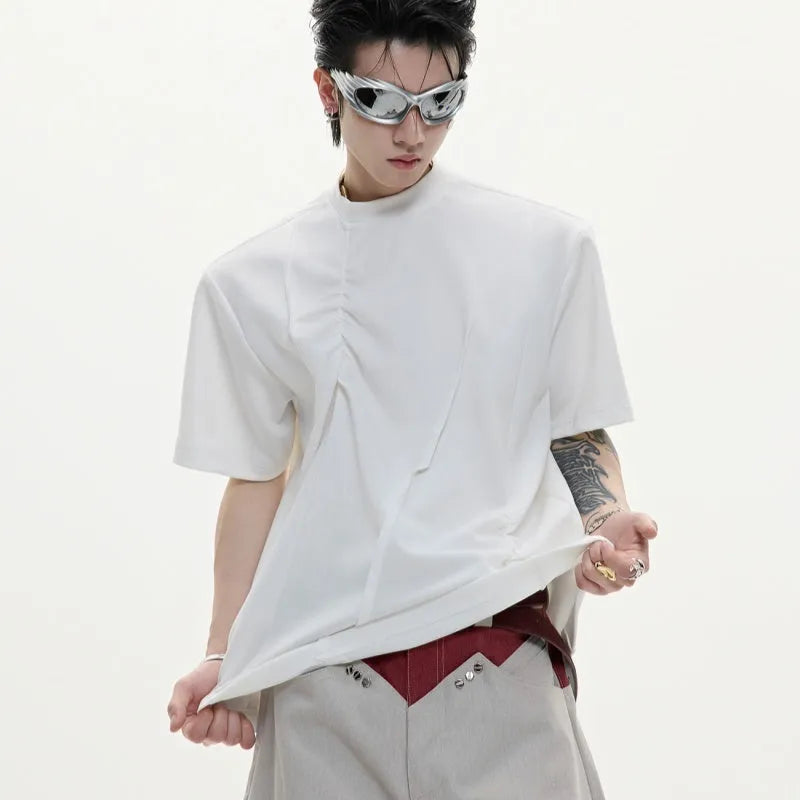 Men's black cotton t-shirt with three-dimensional pleats and asymmetric stitching on a loose fit.