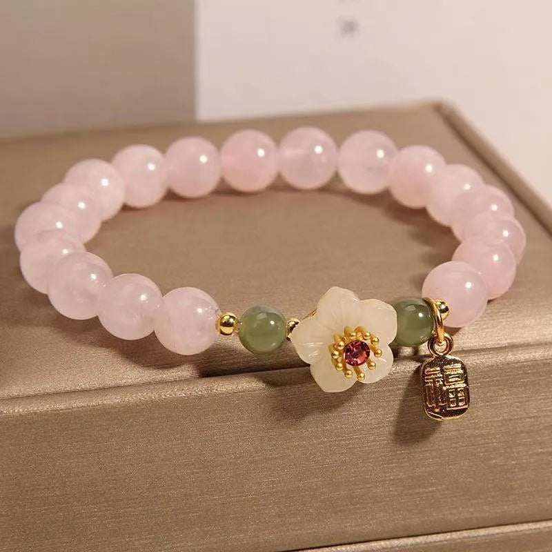Women's crystal beaded bracelet with Hetian jade style beads, a fruit pendant, and camellia motifs in a blessing card colour.