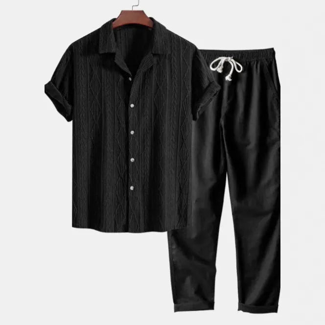 Men's slim-fit camouflage print casual suit consisting of a short-sleeved lapel shirt and matching trousers.