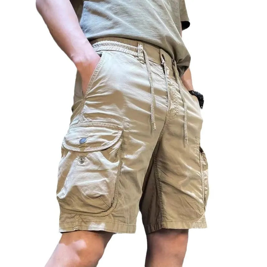 Loose straight-leg Korean-style overalls pants in khaki with multiple pockets and an elasticated waist.